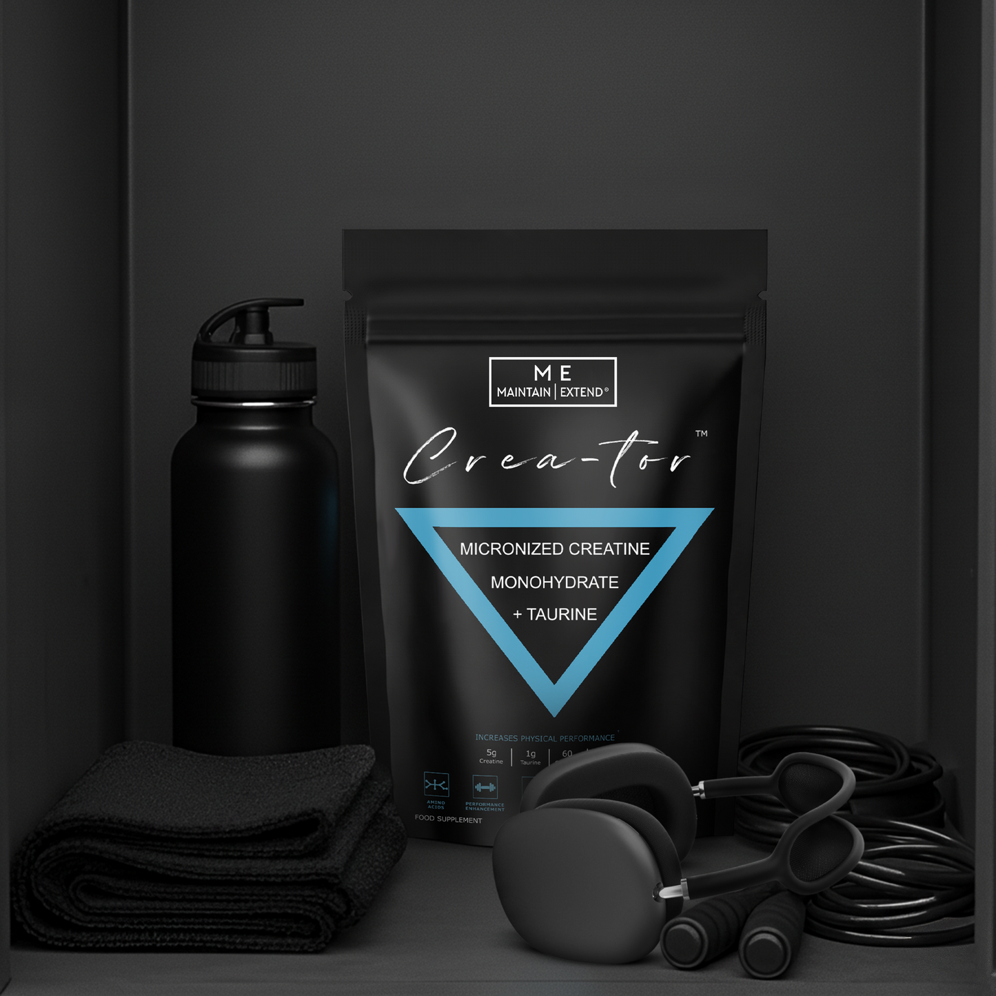 'Crea-tor' pouch with a water bottle, towel, skipping ropes, resistance bands with Apple AirPods Max headphones in a black locker. Ready to use in the gym, martial arts or for any sport.